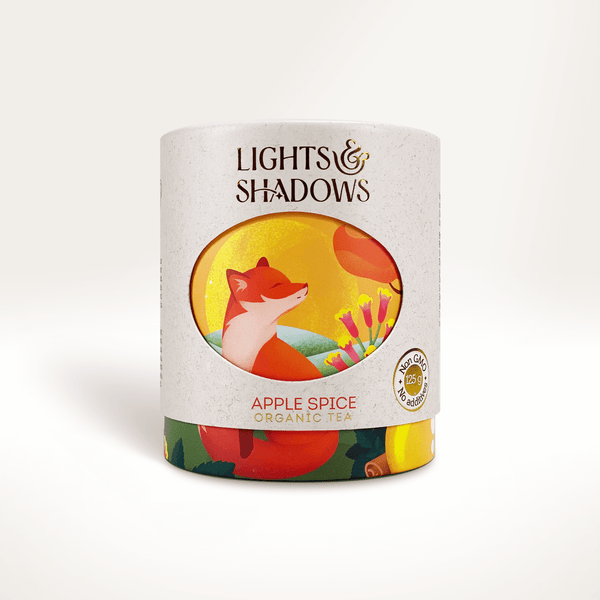 Apple Spice apple and cinnamon rooibos in a Lights & Shadows gift box with a fox in an autumn landscape