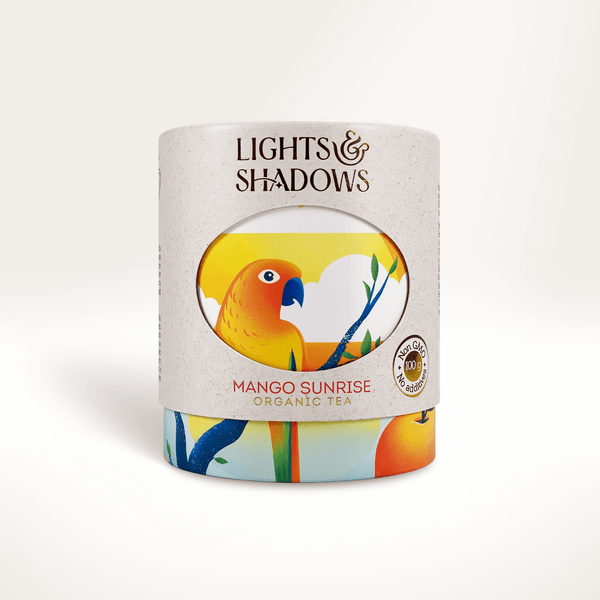 Mango Sunrise green tea with mango and papaya in a Lights & Shadows gift box with a parrot